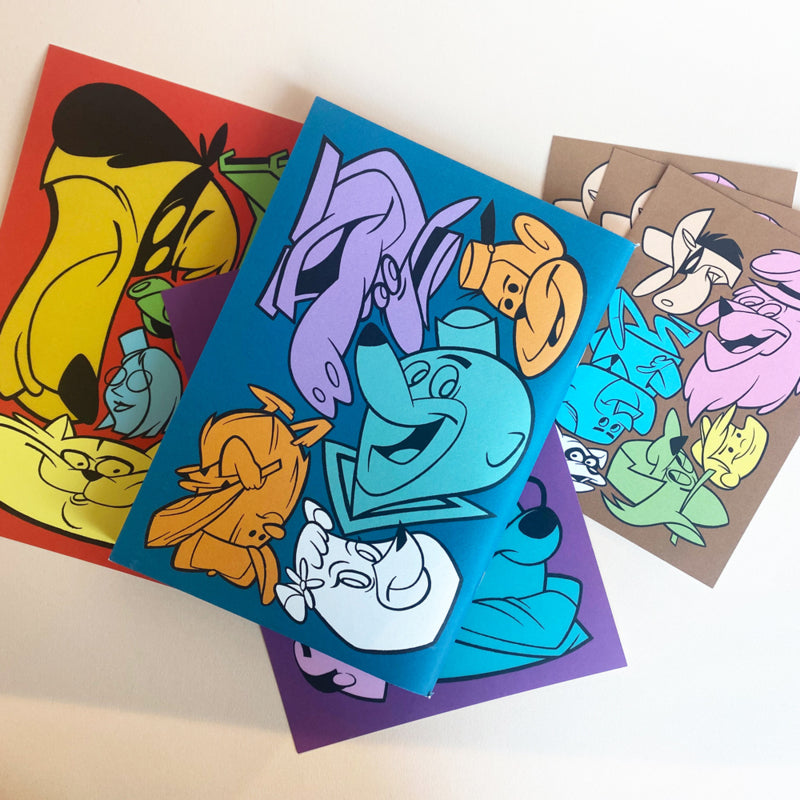 A collection of prints from the book/zine 'Hanna Barbarian II' by Danny Rumbl, featuring colorful, stylized cartoon characters inspired by Hanna-Barbera. The prints include a blue cover with a purple hippo, a yellow character, and other figures, as well as additional prints on red, purple, and brown backgrounds with similarly styled characters.