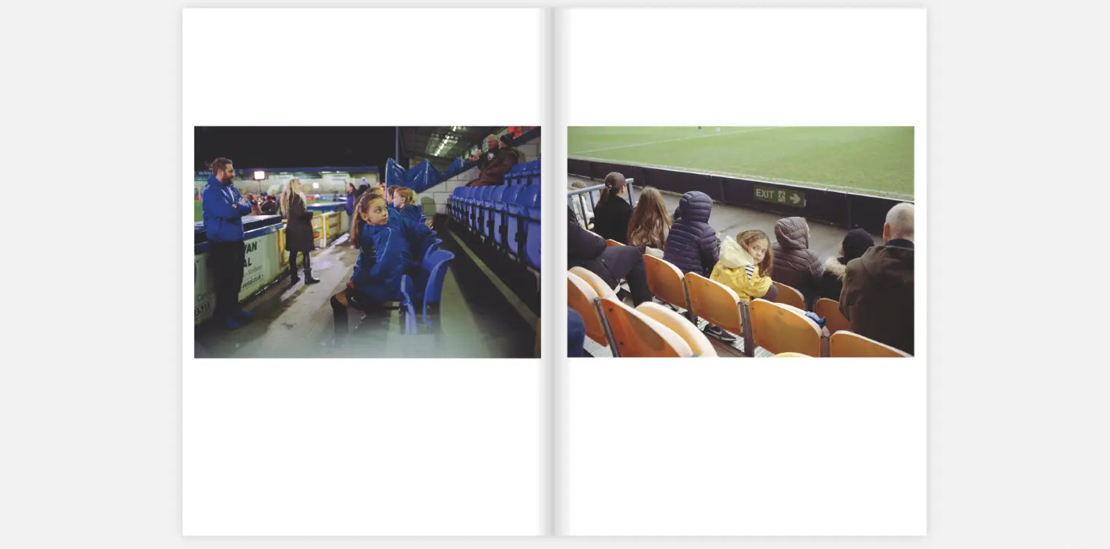 Two-page spread from the zine "The Women's Game" by Claire Wray. The left page shows a nighttime scene at a football stadium with blue seats. A young girl in a blue jacket sits on the edge of a row of seats, looking back at the camera, while a man in a blue jacket and other spectators stand nearby. The right page shows spectators sitting in orange and yellow seats during a daytime match. A young girl in a yellow coat looks back at the camera, with the football field and other spectators in the background.